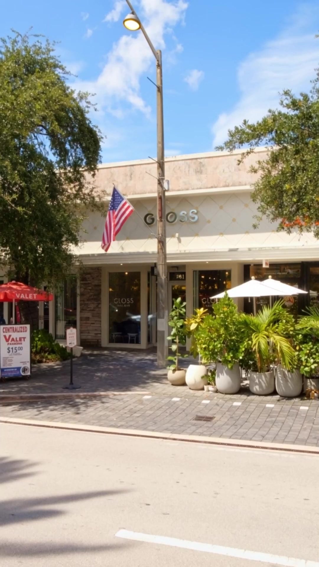 The Gloss Nail Bar storefront at 261 Miracle Mile